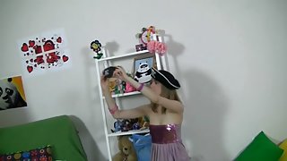 Cute angel plays with hot toys and bear