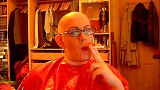 Bald and smoking in rubber cape