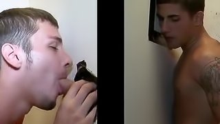 Gay moans with pleasure while getting his dick sucked through a gloryhole