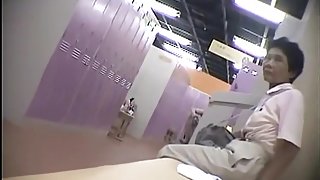 Voyeur spies on naked Asian girls in the changing room